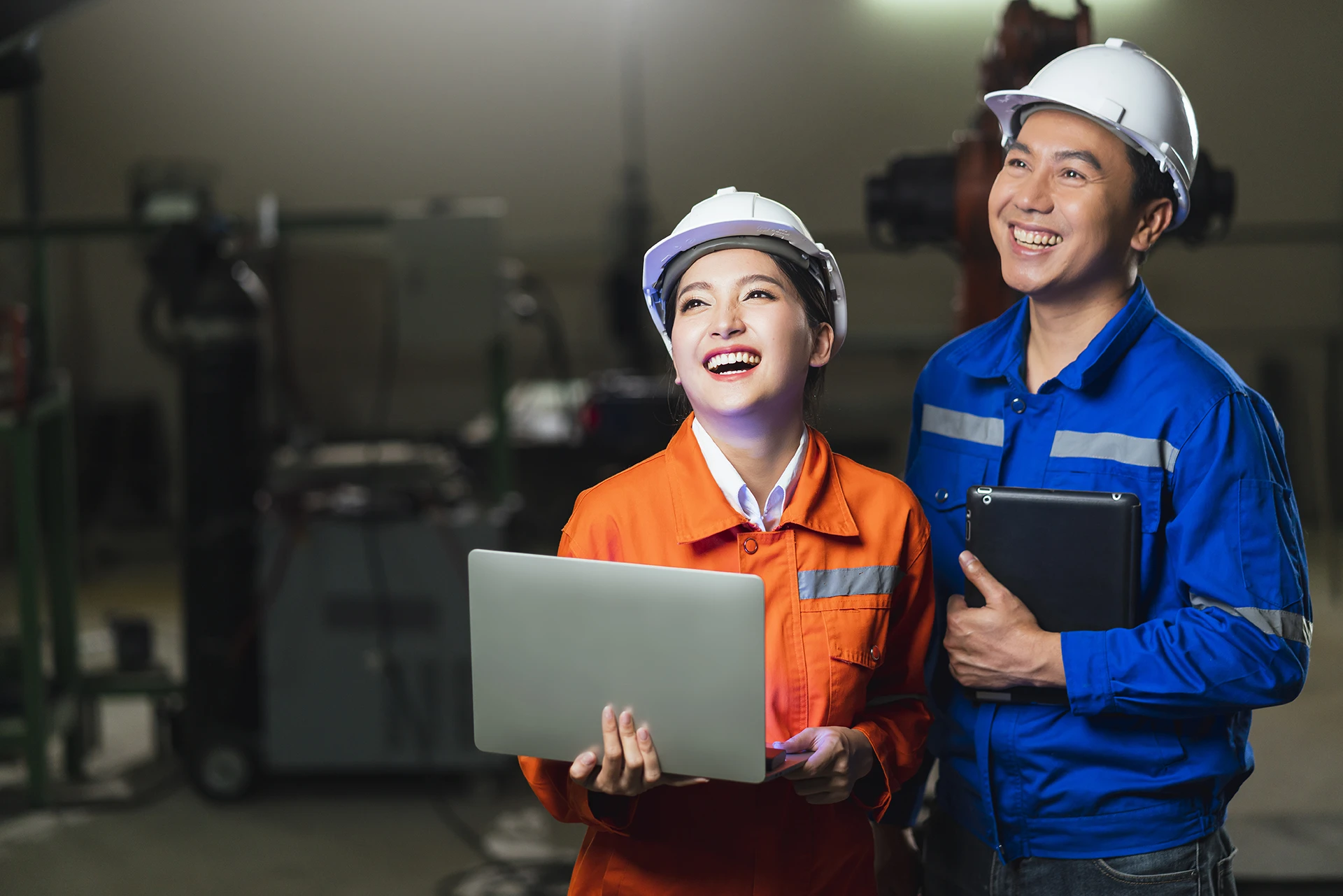 Engineer Male Female Technician Safty Uniform Standing Turn Around Look Camera Laugh Smile With Cheerful Confident Machinery Factory Workplace Background